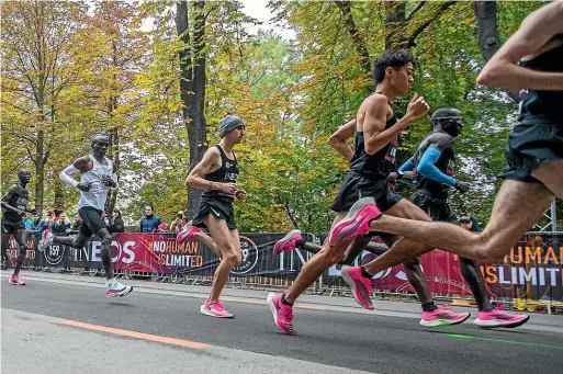  ?? GETTY IMAGES ?? Eliud Kipchoge (in white) on his way to his sub-two-hour marathon win in Vienna in October last year. He was wearing an extreme version of the Vaporfly, with even deeper midsoles said to accommodat­e three carbon plates.