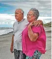  ??  ?? Fisherman Gus Hutt and his wife Sue on Matata Beach, where he found 18-month-old Malachi.