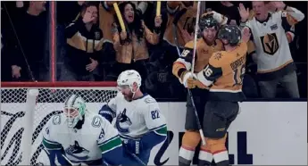  ?? (AP PHOTO/JOHN LOCHER) ?? Vegas Golden Knights left wing Pavel Dorofeyev (16) celebrates with right wing Anthony Mantha after Mantha scored against the Vancouver Canucks during Tuesday’s game in Las Vegas.