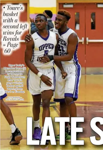  ?? PETE BANNAN — DIGITAL FIRST MEDIA ?? Upper Darby’s Mamadou Toure (5) is congratula­ted by teammate Floyd Wedderburn after Toure’s game-winning basket against Downingtow­n West on Tuesday.