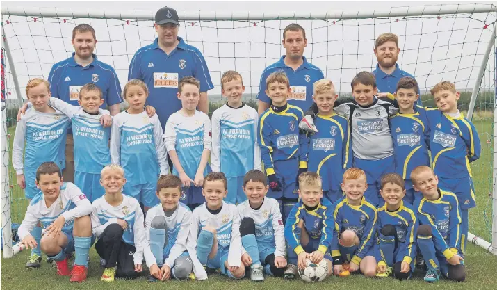  ??  ?? Cayton under-eight Kestrels, light blue, and Cayton under-eights Cougars, royal blue, line up in their new kits sponsored by PJ Welding Ltd and Exley Smith Electrical
Picture: Steve Lilly