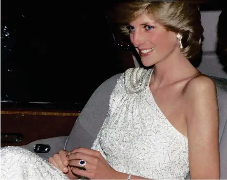  ?? PHOTO: TIM GRAHAM/GETTY IMAGES ?? The Princess of Wales arrive at a gala dinner held at the National Gallery in Washington DC in 1985. Princess Diana wears a white, crystal-beaded silk chiffon assymetric gown by Japanese designer Hachi.