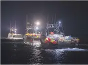  ?? ANDREW VAUGHAN / THE CANADIAN PRESS ?? Lobster boats head from Digby, N.S., to drop their traps. Two fishing boats had been torched earlier last week.