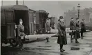  ??  ?? Mask-wearing women hold stretchers during the Spanish flu pandemic in St Louis, Missouri, US, in October 1918. Photograph: Handout ./Reuters