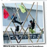  ??  ?? Blockade: Activists use bamboo frame at print works last year