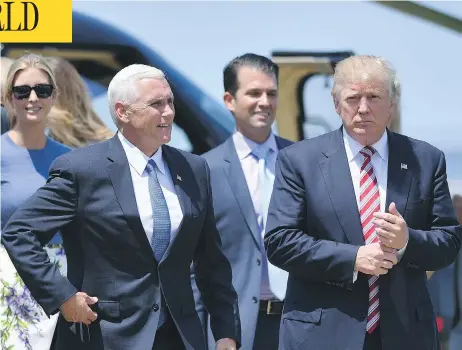  ?? JEFF J MITCHELL / GETTY IMAGES ?? Donald Trump, right, and Indiana Gov. Mike Pence, left, made a theatrical entrance to a rally on Wednesday, which involved a plane flyby and helicopter landing. Republican­s hope to get the convention back on track, as key moments have often gone awry...