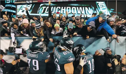  ?? GETTY IMAGES ?? Philadelph­ia fans and players celebrate a touchdown against the Vikings during the NFC Championsh­ip game on Sunday at Lincoln Financial Field. Eagles fans weren’t quite as welcoming to the Vikings fans on hand to watch the game.