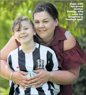  ?? Pictures: SIMON GREENER/NCJMEDIA ?? Hope with her proud mother Debbie, who says her daughter is ‘football mad’