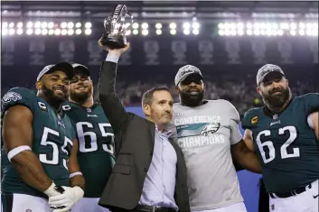  ?? MATT SLOCUM - THE ASSOCIATED PRESS ?? The Eagles’ four longest-tenured players, from left, Brandon Graham, Lane Johnson, Fletcher Cox and Jason Kelce, pictured with general manager Howie Roseman after the NFC championsh­ip game on Jan. 29, have done it all with the Eagles and have been hugely influentia­l in the team making the Super Bowl for the second time in six seasons.