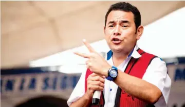  ??  ?? En la mira. El presidente Jimmy Morales ha sido ligado a actos de corrupción.