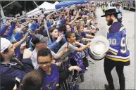  ?? Darron Cummings / Associated Press ?? Blues center Ryan O’Reilly carries the Stanley Cup during the Blues’ Stanley Cup victory celebratio­n in St. Louis on Saturday.