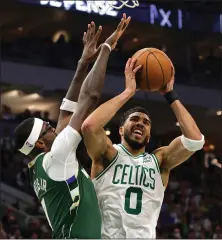  ?? STACY REVERE — GETTY IMAGES ?? The Celtics' Jayson Tatum, who scored 46 points, is defended by the Bucks' Bobby Portis during the second quarter in Game 6on Friday.