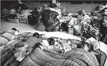  ?? NATACHA PISARENKO/AP ?? A family sleeps in a shelter after having been evacuated from their apartment in a large complex in Mexico City.