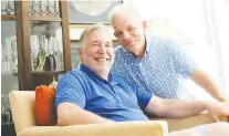  ??  ?? Patrick Gossett, right, and Howard Menaker at their home in Rehoboth Beach, Del., where they live among a number of family treasures.