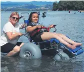  ?? ?? Waihī Beach wheelchair­s being used at Anzac Bay. Maddison Snow and Michelle Kleynhans of Goldfields School. PHOTO: Anna Schroeder.