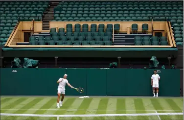  ?? Associated Press ?? Practice: Spain's Rafael Nadal practices against Italy's Matteo Berrettini on Center Court ahead of the 2022 Wimbledon Championsh­ip at the All England Lawn Tennis and Croquet Club Thursday in London.
