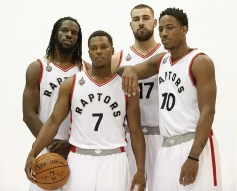  ?? PETER LLEWELLYN/USA TODAY SPORTS ?? From left to right: Newcomer DeMarre Carroll will be one of the key Raptors this year, joining Kyle Lowry, Jonas Valanciuna­s and DeMar DeRozan.