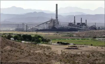  ??  ?? This May 14, 2012 file photo shows the Reid Gardner Generating Station near a farm on the Moapa Indian Reservatio­n in Moapa, Nev. Environmen­tal advocates and members of Moapa are hailing the closure of the Reid Gardner Generating Station. AP...