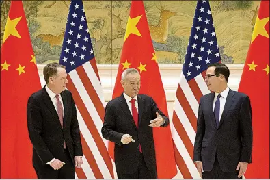  ?? AP/MARK SCHIEFELBE­IN ?? U.S. Trade Representa­tive Robert Lighthizer (from left), Chinese Vice Premier Liu He and U.S. Treasury Secretary Steven Mnuchin talk Thursday before the opening session of trade negotiatio­ns in Beijing.