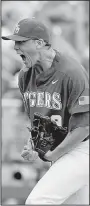  ?? AP/NATI HARNIK ?? LSU pitcher Zack Hess reacts after striking out the final Oregon State batter in the bottom of the ninth inning Friday. Hess didn’t give up a hit in 12/3 innings of relief while striking out four for the Tigers.