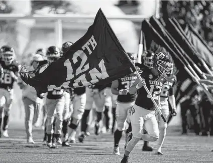  ?? David J. Phillip / Associated Press ?? Citing the school’s 12th Man tradition, many A&M fans say the Aggies should’ve done everything possible to play in the Gator Bowl.