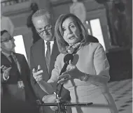  ?? AFP VIA GETTY IMAGES ?? House Speaker Nancy Pelosi, D- Calif., flanked by Sen. Chuck Schumer, D- N. Y. after meeting Friday on coronaviru­s relief