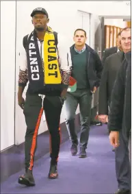  ?? Rick Rycroft / Associated Press ?? Jamaica’s Usain Bolt, left, arrives in Sydney on Saturday. Bolt is hoping to impress the coaching staff enough to earn a contract with the Central Coast Mariners in Australia’s top-flight soccer competitio­n.