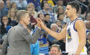  ?? ANDA CHU — STAFF PHOTOGRAPH­ER ?? “He chases the ball all day long,” Warriors coach Steve Kerr, left, says about guard Klay Thompson’s defensive prowess. Thompson credits coaches in high school and at Washington State for sparking his interest in playing defense.