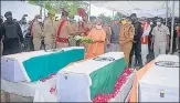  ?? HT PHOTO ?? ■
Chief minister Yogi Adityanath laying wreaths on the coffins of the slain policemen in Kanpur on Friday.