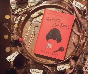  ?? TinaMarie Craven / Hearst Connecticu­t Media ?? “The Girls I’ve Been” is a YA thriller about a former con artist by Tess Sharpe.
