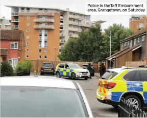  ??  ?? Police in theTaff Embankment area, Grangetown, on Saturday