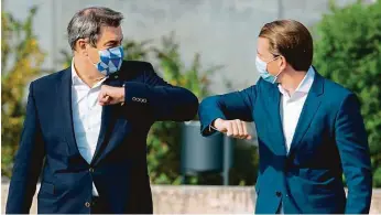  ?? FOTO ČTK/AP ?? Z jednoho těsta byli Marcus Söder (vlevo) a Sebastian Kurz. Nyní se poprvé dostali do sporu.