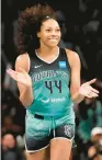  ?? ?? New York Liberty forward Betnijah Laney smiles after hitting a 3-pointer against the Connecticu­t Sun during the second half.