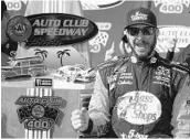  ?? SARAH CRABILL/GETTY IMAGES ?? Martin Truex Jr. dominated Sunday, winning both stages before taking the checkered flag for his 16th career victory.