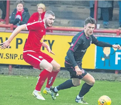  ?? Picture: Andy Thompson. ?? Brechin’s Ryan McGeever tracks Arbroath’s Michael McKenna.