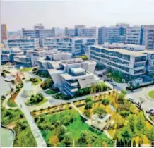  ??  ?? Establishe­d in Pudong in July 1992, Zhangjiang Hi-tech Park aims to be a “science city” suitable for residentia­l living. by Liu Sihong