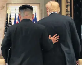  ?? /Reuters (See Page 12) ?? Pat on the back: US President Donald Trump and North Korean leader Kim Jong-un leave after their summit on Sentosa island in Singapore on Tuesday, where they signed documents that agree to seek the complete denucleari­sation of the Korean Peninsula.