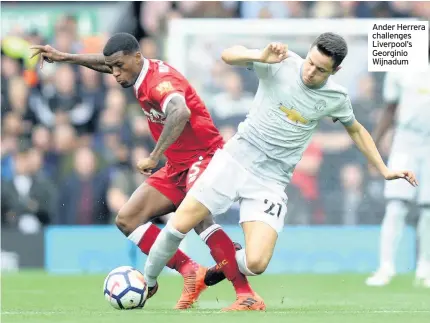  ??  ?? Ander Herrera challenges Liverpool’s Georginio Wijnadum