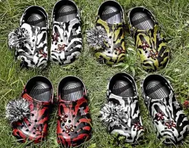  ??  ?? The Christophe­r Kane x Crocs collection features tiger prints in four different color options.