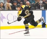  ?? Winslow Townson / Associated Press ?? The Boston Bruins’ David Pastrnak shoots during the second period against the San Jose Sharks in Boston in October.