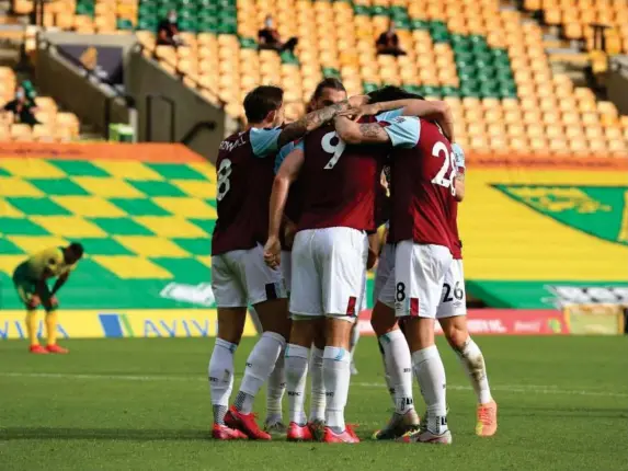  ?? (PA) ?? The Clarets celebrate clinching a top-10 finish