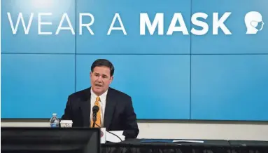  ??  ?? Arizona Gov. Doug Ducey speaks about the latest data for the new coronaviru­s at a news conference on Thursday in Phoenix. ROSS D. FRANKLIN/AP