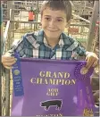  ??  ?? Samuel Huston, 9, took home Grand Champion with his Poland, Charlotte.