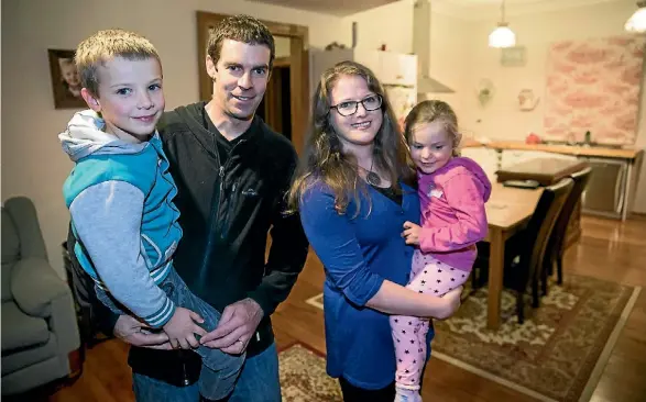  ?? PHOTO: DAVID UNWIN/FAIRFAX NZ ?? Feilding couple Ian and Katie Burgers, with their two children Liam and Rebecca, see some good things and bad things in the Budget.