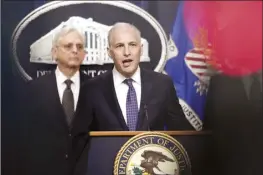  ?? AP file photo ?? Justice Department’s Assistant Attorney General for the National Security Division Matthew Olsen speaks during a news conference at the Department of Justice in Washington on Jan. 27, as Attorney General Merrick Garland listens at left. The Biden administra­tion officials urged Congress on Tuesday to renew a surveillan­ce program that the U.S. government has long seen as vital in countering overseas terrorism, cyberattac­ks and espionage operations. The program, which is under the Foreign Intelligen­ce Surveillan­ce Act, or FISA, is set to expire at year’s end unless Congress agrees to renew it.