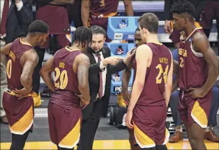  ?? C. Morgan Engel / NCAA Photos via Getty Images ?? Iona coach Rick Pitino talks to his team during a timeout on Saturday against Alabama. The Gaels are the fifth team Pitino has taken to March Madness.