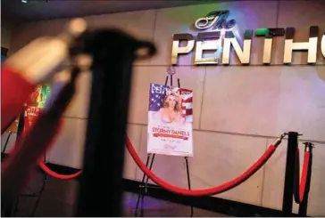  ?? DOMINICK REUTER/AFP ?? A poster promoting adult film star Stephanie Clifford, also known as Stormy Daniels, is seen outside the Penthouse Club in Philadelph­ia, Pennsylvan­ia, on May 7.