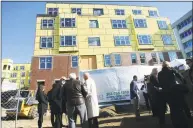  ?? Hearst Connecticu­t Media file photo ?? Crowds gather for the dedication ceremony to mark the completion of the latest phase of constructi­on at the LCB senior living complex on 2nd Street in downtown Stamford in 2017.