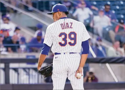  ?? Mary Altaffer / Associated Press ?? Mets closer Edwin Diaz gets ready to pitch in the ninth inning of the first game of a baseball doublehead­er against the Braves on Aug. 6, in New York. The Mets won 8-5.