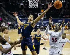  ?? Jay Biggerstaf­f/Getty Images ?? West Virginia’s Jesse Edwards, center, has been invited to play in the 2024 NABC – Reese’s Division I College All-Star Game, featuring top senior talent from across NCAA Division I.